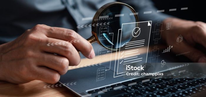 Businessman Inspecting Paperwork Document of Business Data Analysis working Management report with KPI and metrics connected to database. Corporate strategy for finance, operations, sales, marketing.